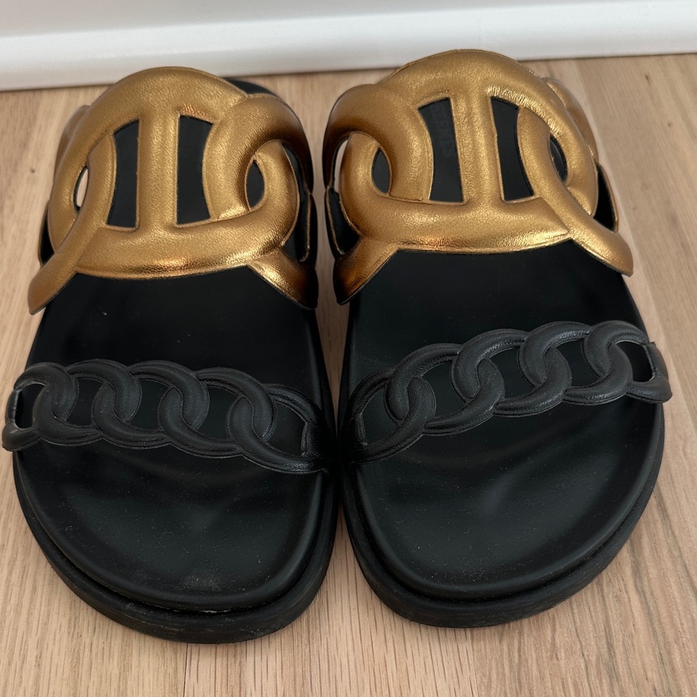 Hermes extra sandals in black and gold